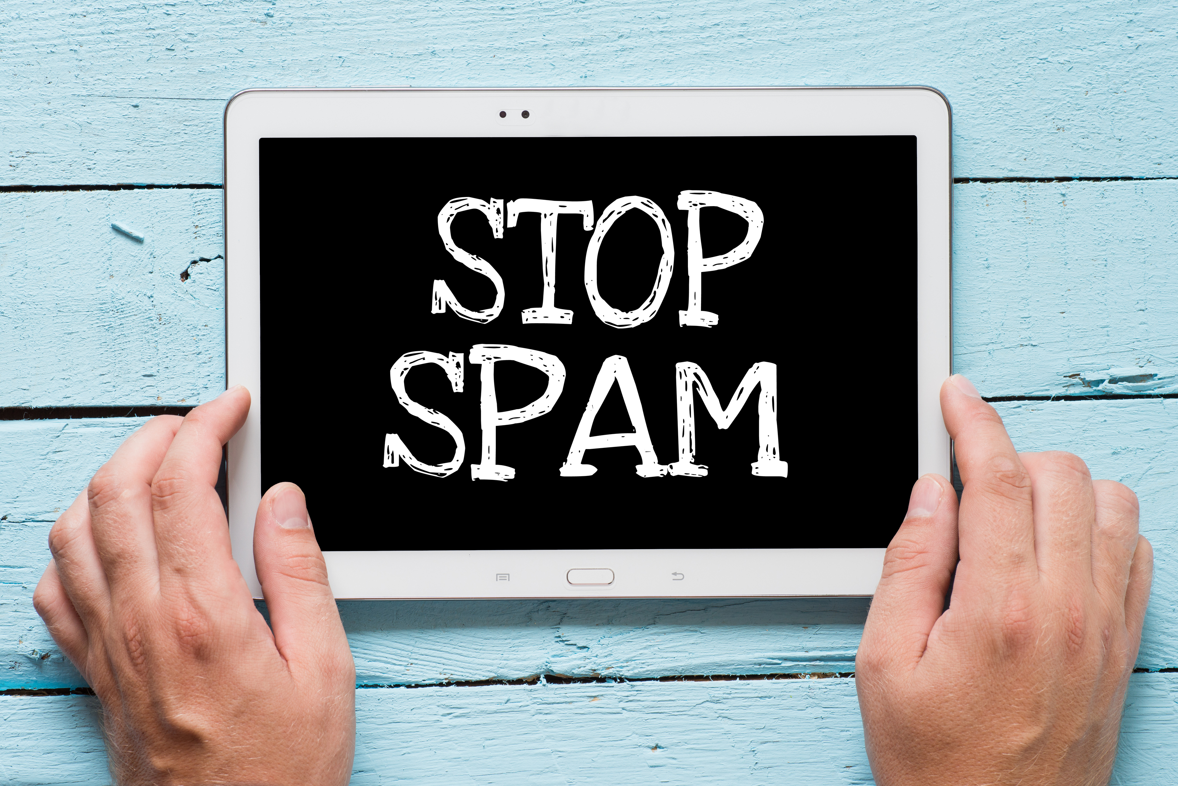 Modern tablet pc with slogan stop spam hin
